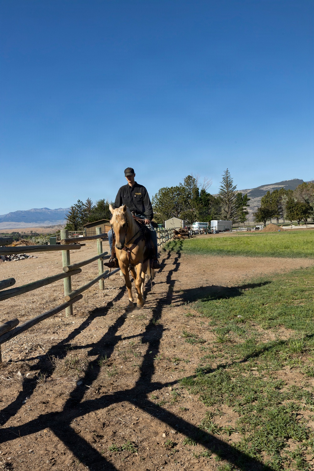 U.S. Marine Corps Mounted Color Guard participates in the Cody Stampede