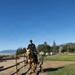 U.S. Marine Corps Mounted Color Guard participates in the Cody Stampede