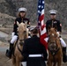 U.S. Marine Corps Mounted Color Guard participates in the Cody Stampede