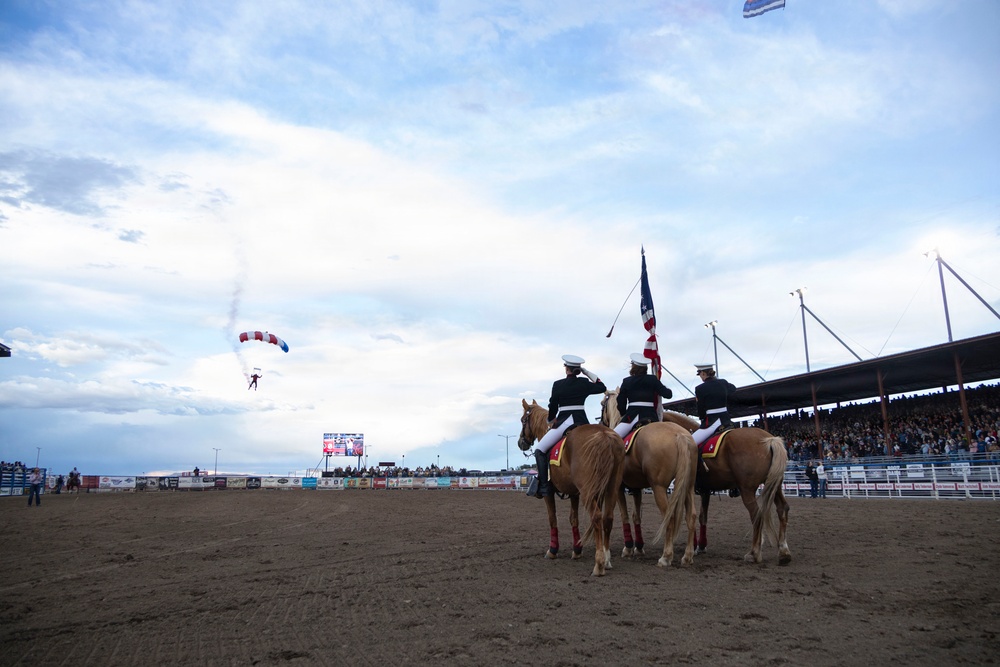 U.S. Marine Corps Mounted Color Guard participates in the Cody Stampede