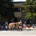 U.S. Marine Corps Mounted Color Guard participates in the Cody Stampede