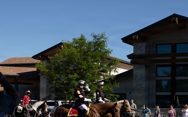 U.S. Marine Corps Mounted Color Guard participates in the Cody Stampede