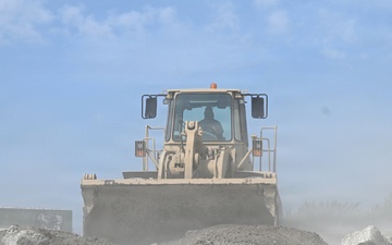 119th Wing Airman Clears Debris from Airfield