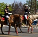 U.S. Marine Corps Mounted Color Guard participates in the Cody Stampede