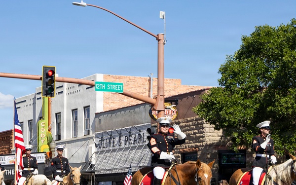 U.S. Marine Corps Mounted Color Guard participates in the Cody Stampede
