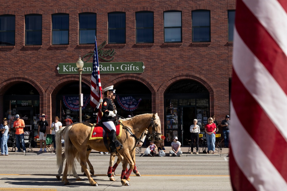 U.S. Marine Corps Mounted Color Guard participates in the Cody Stampede
