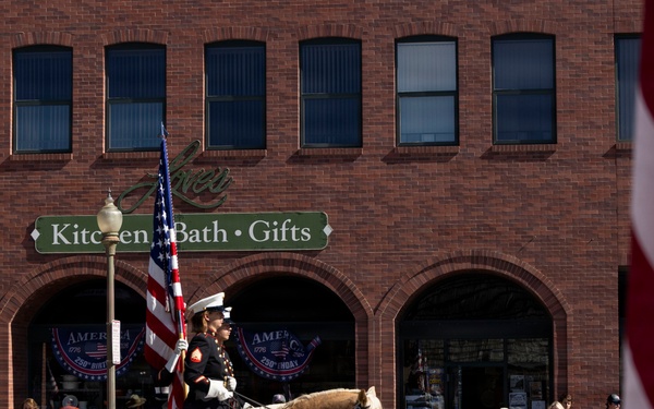 U.S. Marine Corps Mounted Color Guard participates in the Cody Stampede