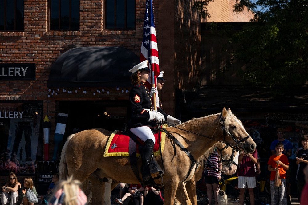 U.S. Marine Corps Mounted Color Guard participates in the Cody Stampede