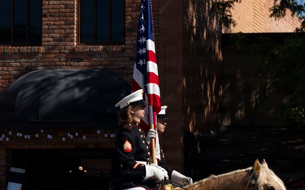 U.S. Marine Corps Mounted Color Guard participates in the Cody Stampede