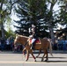 U.S. Marine Corps Mounted Color Guard participates in the Cody Stampede