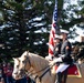 U.S. Marine Corps Mounted Color Guard participates in the Cody Stampede