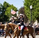 U.S. Marine Corps Mounted Color Guard participates in the Cody Stampede