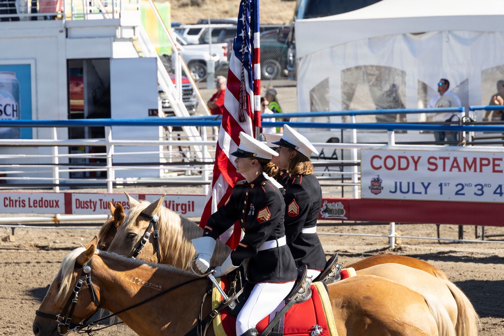 U.S. Marine Corps Mounted Color Guard participates in the Cody Stampede