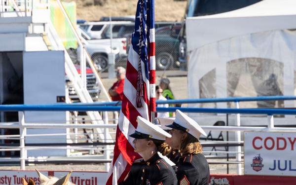 U.S. Marine Corps Mounted Color Guard participates in the Cody Stampede