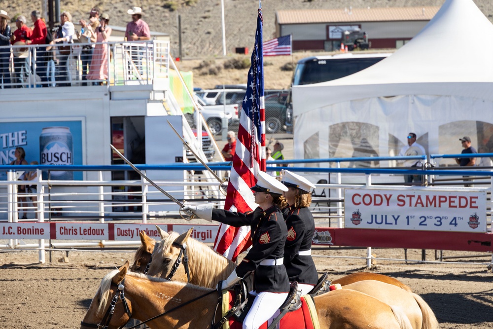 U.S. Marine Corps Mounted Color Guard participates in the Cody Stampede