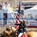 U.S. Marine Corps Mounted Color Guard participates in the Cody Stampede