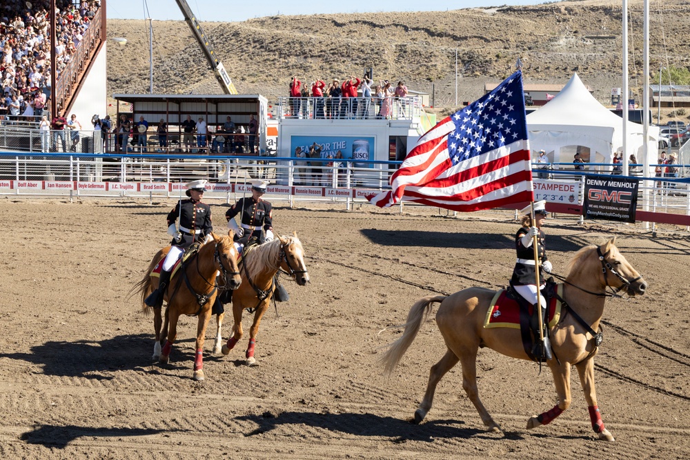 U.S. Marine Corps Mounted Color Guard participates in the Cody Stampede