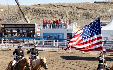 U.S. Marine Corps Mounted Color Guard participates in the Cody Stampede