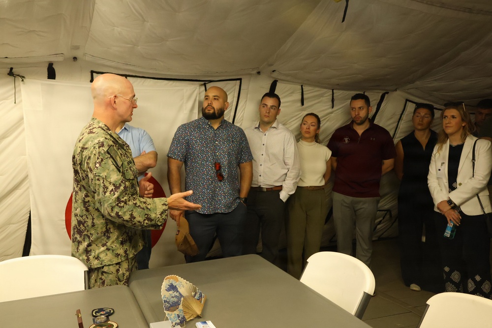 U.S. Navy Capt. Steven Sherman welcomes staff delegates to the humanitarian assistance and disaster relief camp
