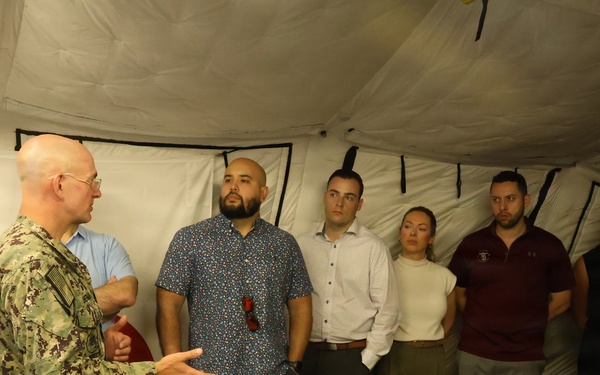 U.S. Navy Capt. Steven Sherman welcomes staff delegates to the humanitarian assistance and disaster relief camp