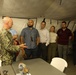 U.S. Navy Capt. Steven Sherman welcomes staff delegates to the humanitarian assistance and disaster relief camp