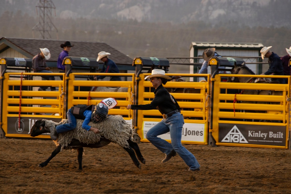 U.S. Marine Corps Mounted Color Guard participates in the Rooftop Rodeo