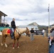 U.S. Marine Corps Mounted Color Guard participates in the Rooftop Rodeo