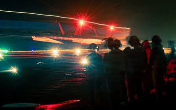 Distinguished visitors observe night flight operations onboard Nimitz-class aircraft carrier USS Theodore Roosevelt (CVN 71) during RIMPAC 26