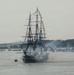 USS Constitution renders a gun salute during the Sail250 Boston Parade of Sail