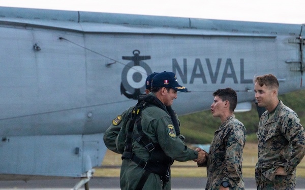 U.S. Marines, Peruvian Navy service members refuel SH-3 Sea King helicopter