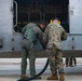 U.S. Marines, Peruvian Navy service members refuel SH-3 Sea King helicopter