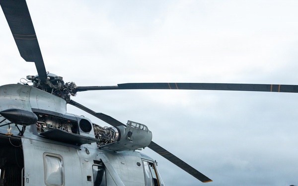 U.S. Marines, Peruvian Navy service members refuel SH-3 Sea King helicopter