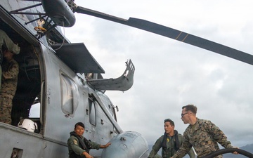U.S. Marines, Peruvian Navy service members refuel SH-3 Sea King helicopter