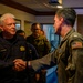 USS Theodore Roosevelt (CVN 71) Commanding Officer greets Polish Navy Rear Admiral during RIMPAC 26