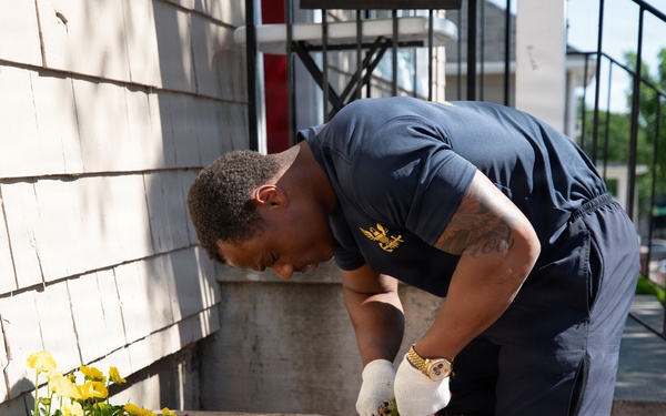 USS Arlington Sailor Plants Flowers at Sail250 Boston COMREL