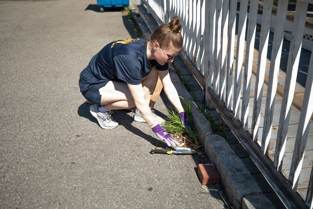USS Arlington Sailor Pulls Weeds at Sail250 Boston COMREL