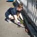 USS Arlington Sailor Pulls Weeds at Sail250 Boston COMREL