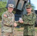 U.S. Army and Japanese commanding officers exchange memorabilia during RIMPAC 2026