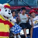 Sasebo community members pose for a photo with Sparky during Independence Day celebration