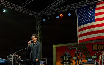 Sasebo City Mayor Daisuke Miyajima delivers closing remarks during the Independence Day celebration