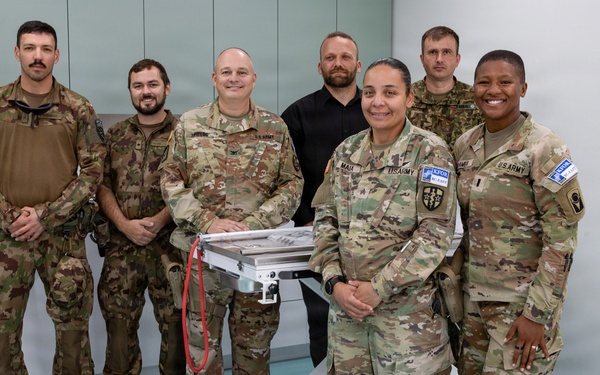KFOR RC-E presents veterinary equipment to local clinic
