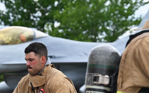 119th Wing Fire Crew Chief Advances Hose Line