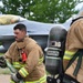 119th Wing Fire Crew Chief Advances Hose Line