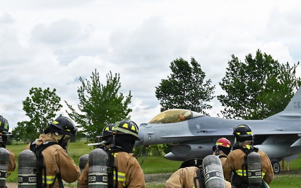 119th Wing Firefighters Approach Simulated F-16 Fire