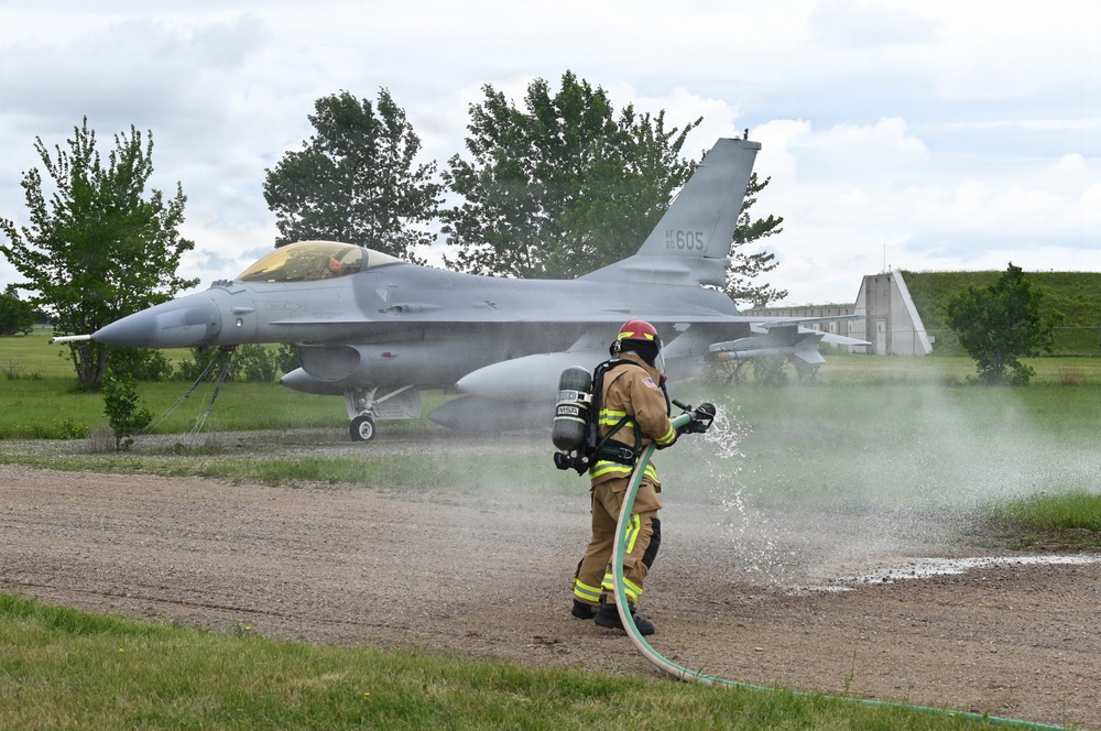 119th Wing Firefighter Stands By with Hose Line