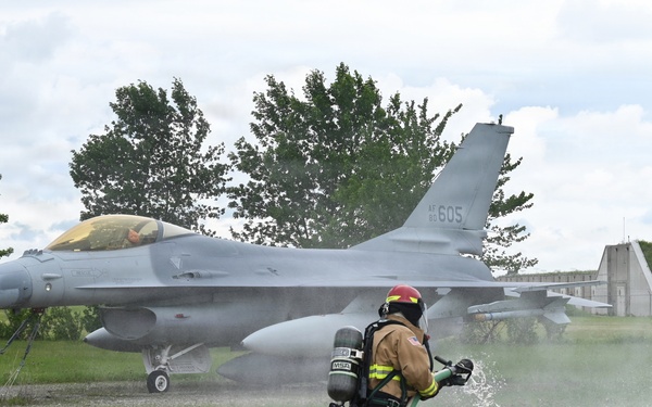 119th Wing Firefighter Stands By with Hose Line