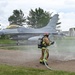 119th Wing Firefighter Stands By with Hose Line