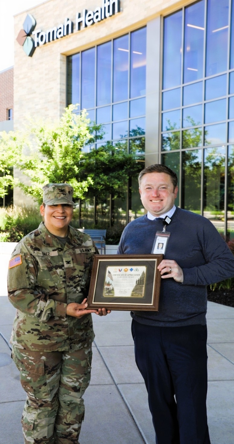 U.S. Army Garrison-Fort McCoy commander presents Garrison Certificate of Appreciation to health org in Tomah for support of installation community