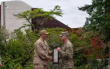 Major General Thomas Friloux Presents Governor's Commendation to USS Louisiana