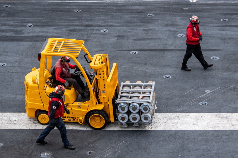 USS Carl Vinson (CVN 70) conducts ammunition onload